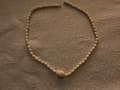 Stime dei Gioielli: Una Valutazione della Collana di Perle in Avorio 37 cm