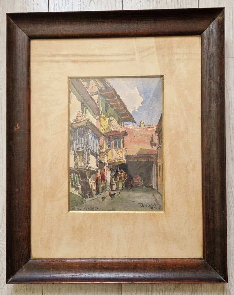 Stima di dipinto: Acquerello originale firmato da Jean-Jacques Waltz, conosciuto con il nome di Hansi, datato 28 Luglio 1929, che rappresenta una strada di Obernai